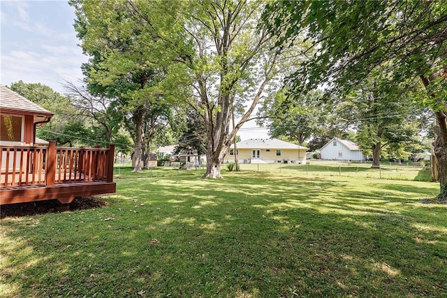 view of yard with a wooden deck