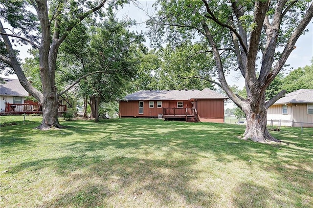 view of yard with a wooden deck