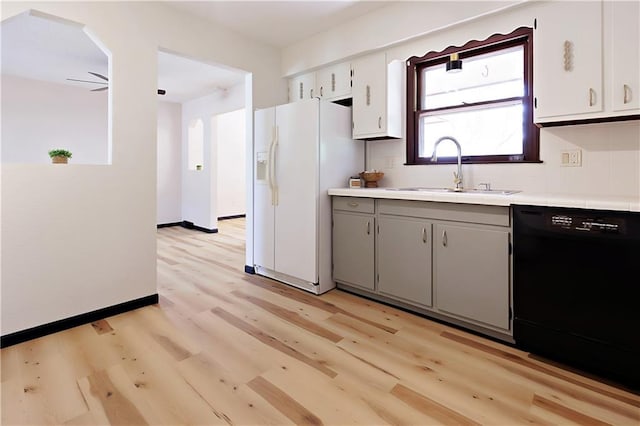 kitchen with light hardwood / wood-style floors, sink, white cabinets, and dishwasher