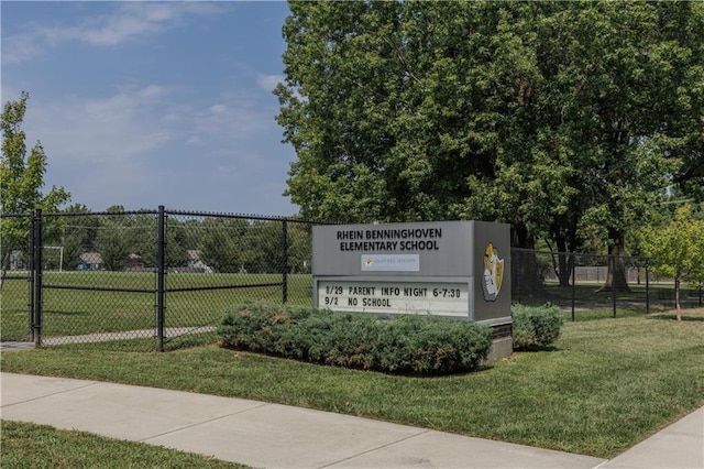 view of property's community with a yard