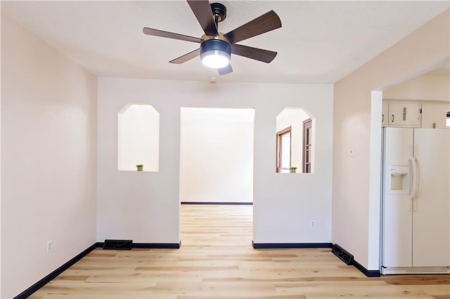 spare room with ceiling fan and light hardwood / wood-style floors