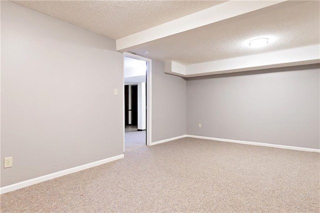 basement with a textured ceiling and carpet