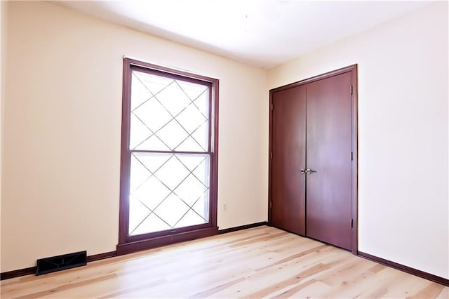 foyer entrance with light wood-type flooring