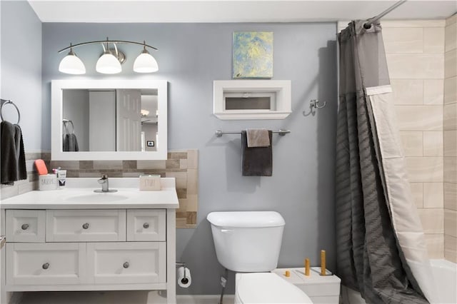 full bathroom featuring tasteful backsplash, vanity, shower / bath combination with curtain, and toilet