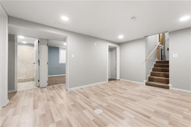 basement featuring light hardwood / wood-style flooring