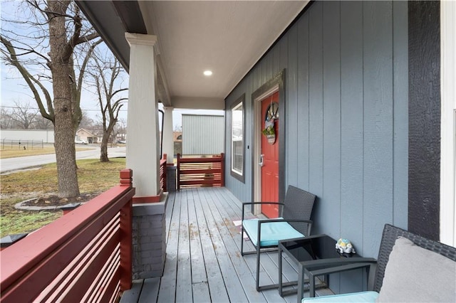 wooden deck featuring covered porch