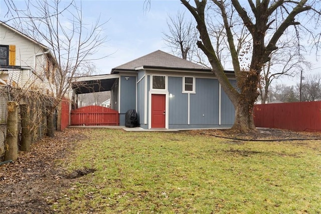 view of outbuilding featuring a lawn