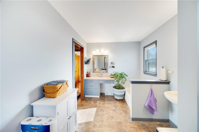 bathroom with baseboards