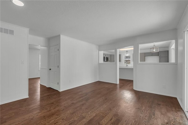 unfurnished living room featuring dark wood-type flooring