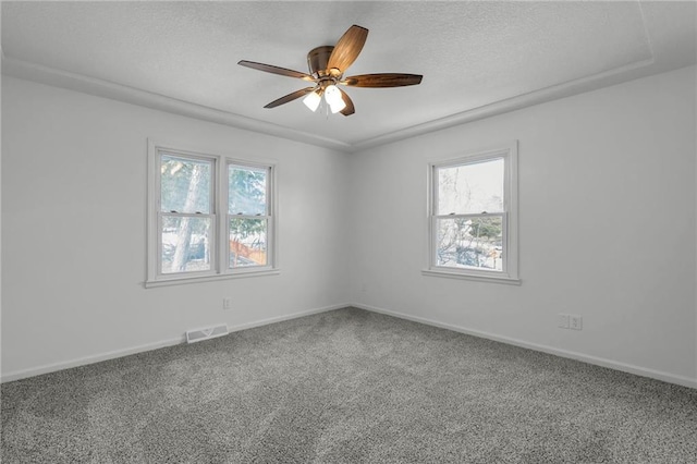 unfurnished room featuring ceiling fan and carpet flooring