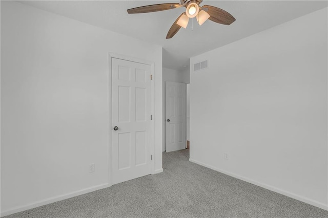 unfurnished bedroom featuring ceiling fan and carpet flooring