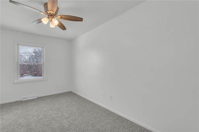 empty room featuring ceiling fan and carpet flooring