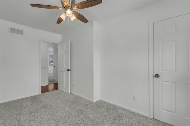 unfurnished bedroom with ceiling fan and carpet flooring