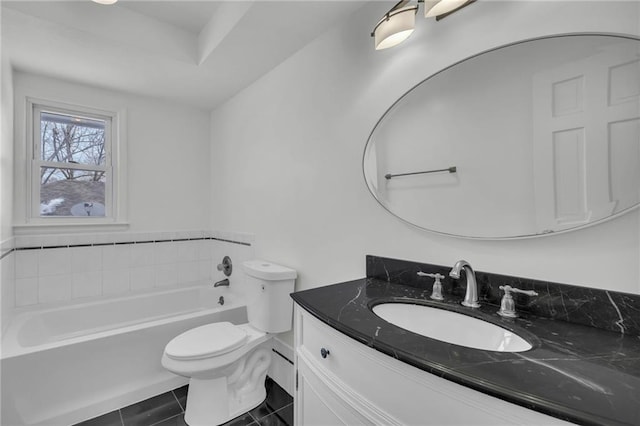 bathroom with vanity, toilet, tile patterned flooring, and a washtub