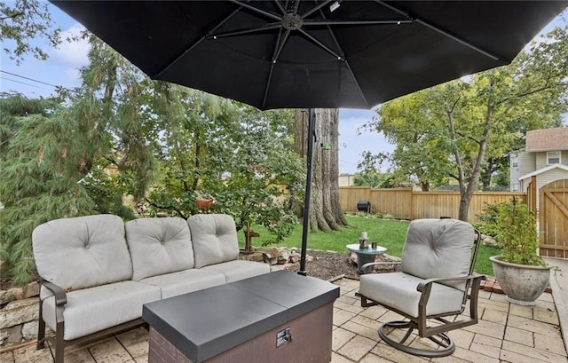 view of patio / terrace with a fenced backyard and an outdoor living space