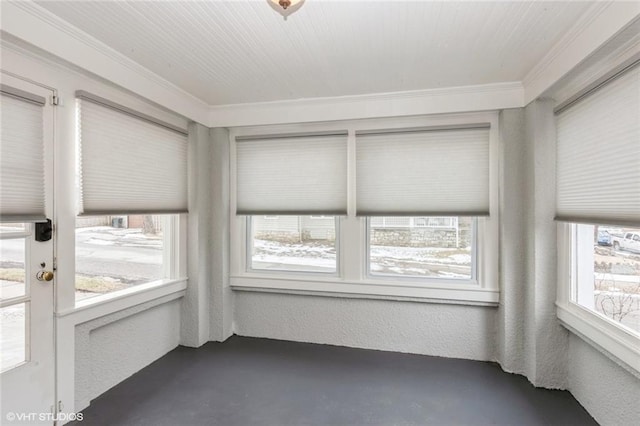 unfurnished sunroom featuring a wealth of natural light