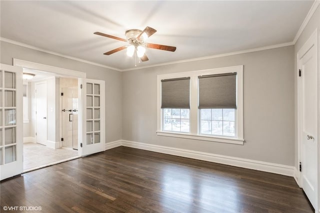 empty room with french doors, dark wood-type flooring, and crown molding