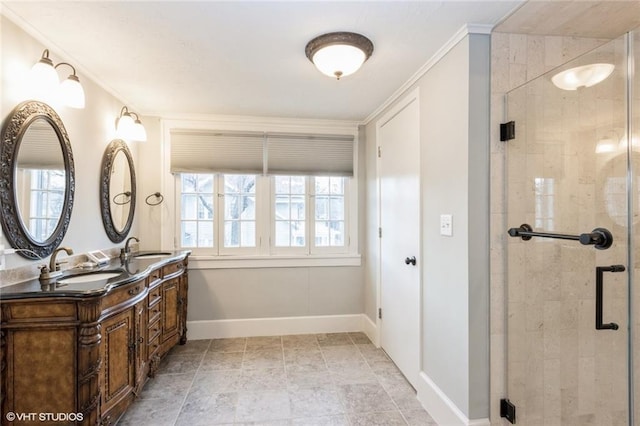 bathroom with a wealth of natural light, a sink, and baseboards