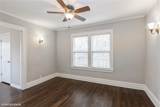 empty room featuring ceiling fan, dark wood-type flooring, visible vents, baseboards, and ornamental molding