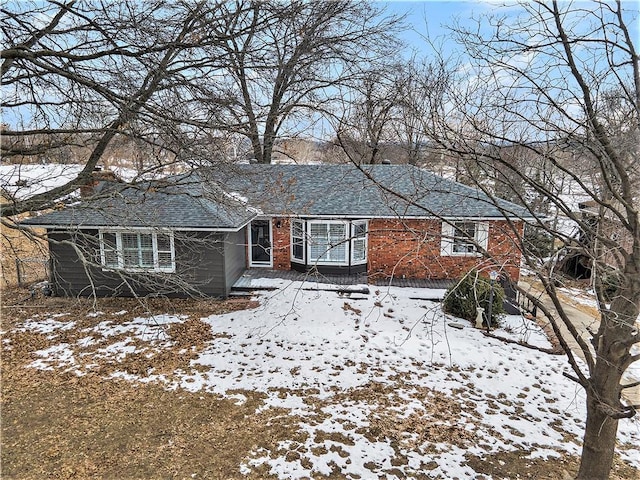 view of snow covered house