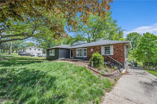 10609 NW Meadow Lane Dr, Parkville, MO 64152 - view of front of property featuring brick siding and a front lawn