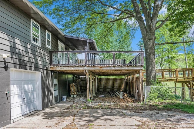 10609 NW Meadow Lane Dr, Parkville, MO 64152 - exterior space featuring concrete driveway, an attached garage, and fence