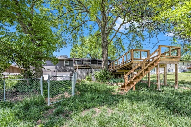 10609 NW Meadow Lane Dr, Parkville, MO 64152 - rear view of property with stairs, fence, and a wooden deck
