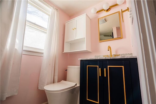 bathroom with vanity and toilet