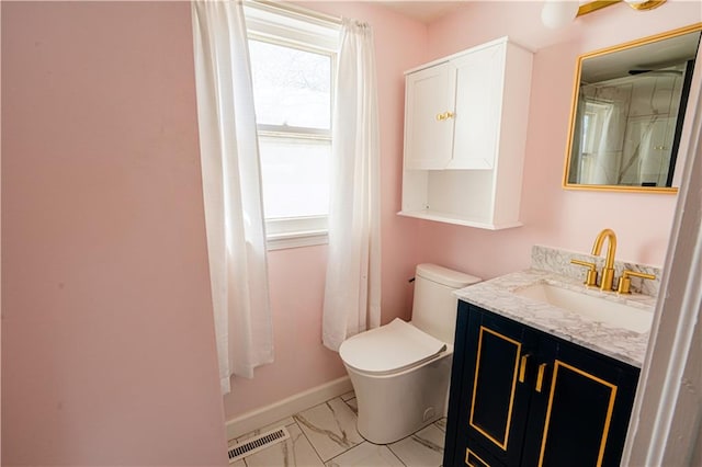 bathroom with marble finish floor, visible vents, toilet, vanity, and baseboards