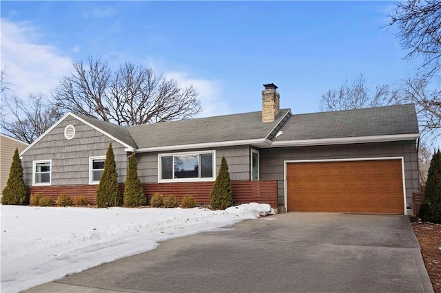 ranch-style home featuring a garage