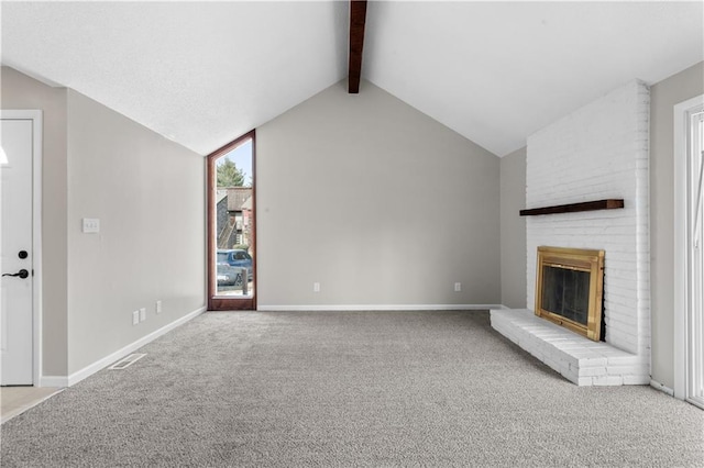 unfurnished living room with vaulted ceiling with beams, a fireplace, and light colored carpet