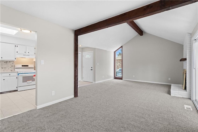 unfurnished living room with light colored carpet and vaulted ceiling with beams