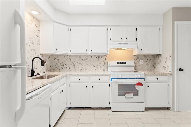 kitchen with light tile patterned flooring, white cabinetry, sink, decorative backsplash, and white appliances