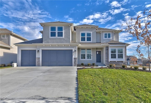 view of front of house with a garage and a front lawn