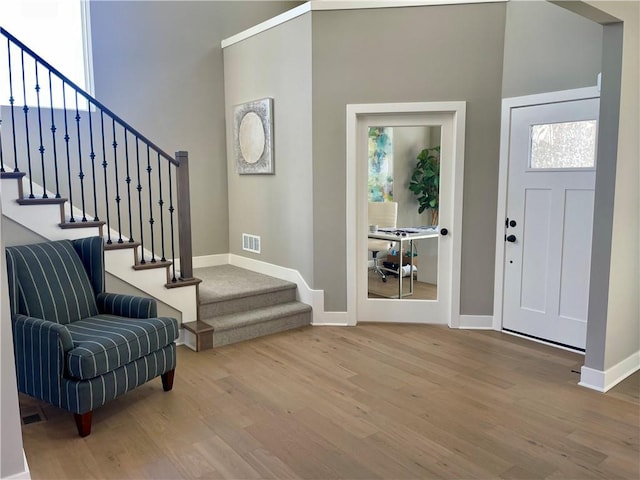 foyer entrance featuring hardwood / wood-style floors