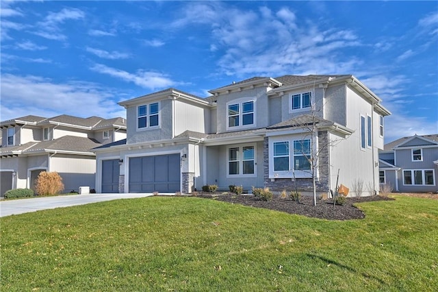 view of front of property with a garage and a front yard