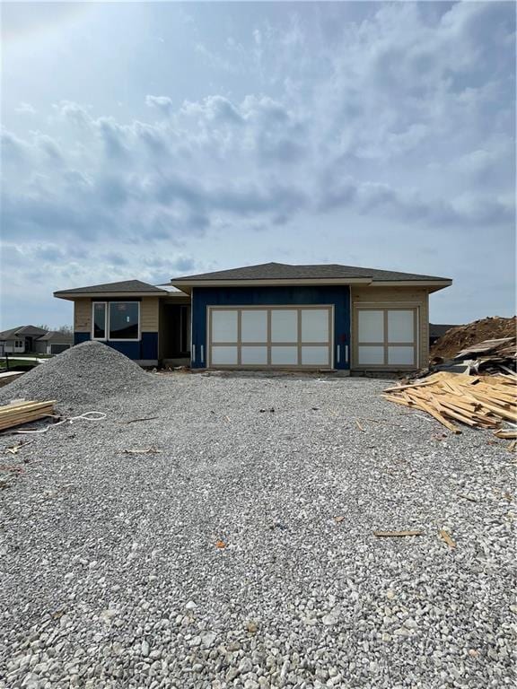 17312 Oakshire St, Overland Park, KS 66221 - view of front facade with a garage