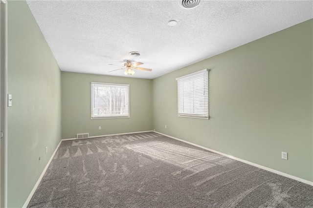 unfurnished room with carpet, a textured ceiling, and ceiling fan