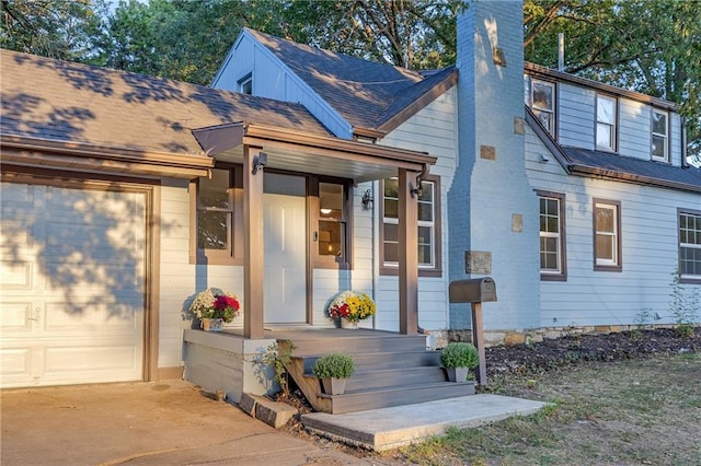 view of front facade with covered porch and a garage