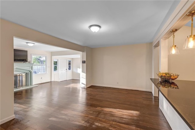 empty room with dark hardwood / wood-style flooring