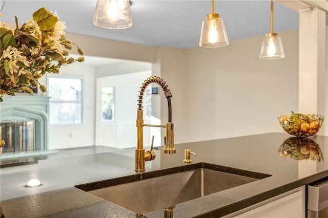 interior details with hanging light fixtures and sink