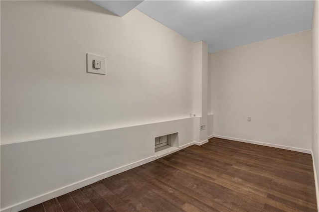 spare room featuring dark hardwood / wood-style flooring