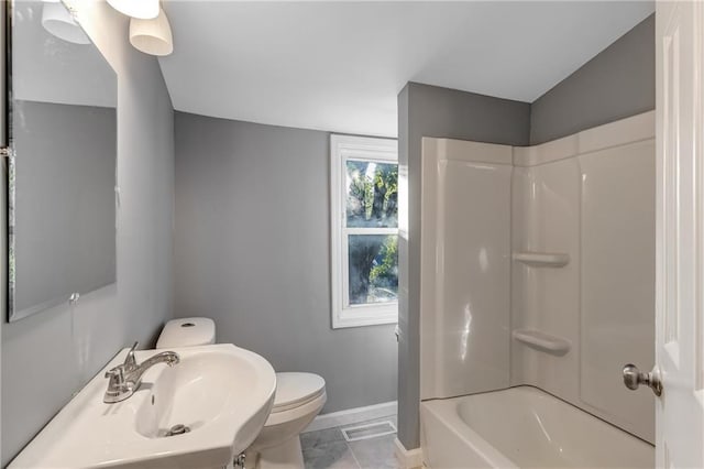 full bathroom featuring toilet, tile patterned flooring, shower / washtub combination, and sink