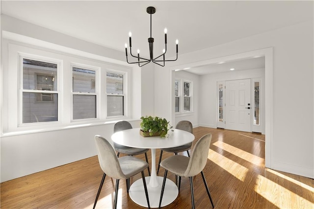 dining room featuring a chandelier and hardwood / wood-style flooring