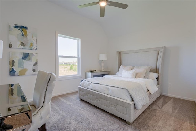 bedroom with ceiling fan, vaulted ceiling, and light carpet