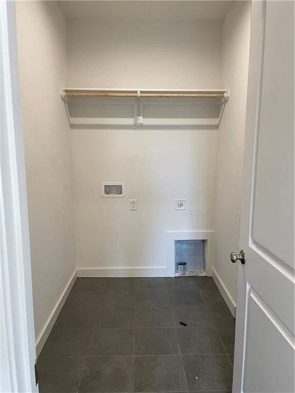 18300 Monrovia St, Overland Park, KS 66013 - laundry room with hookup for an electric dryer, washer hookup, and dark tile patterned flooring