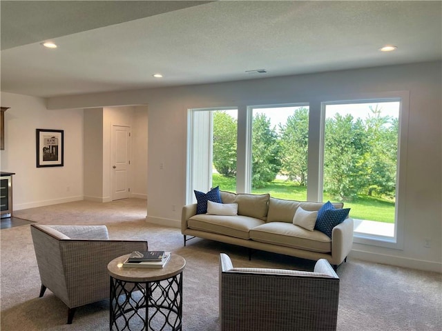 18300 Monrovia St, Overland Park, KS 66013 - living room with light colored carpet, healthy amount of natural light, and recessed lighting