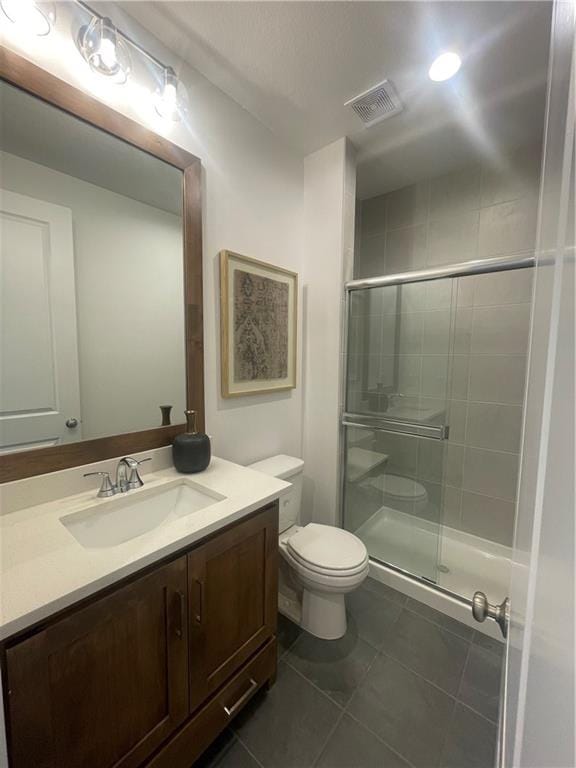 18300 Monrovia St, Overland Park, KS 66013 - full bathroom with vanity, tile patterned floors, and a stall shower