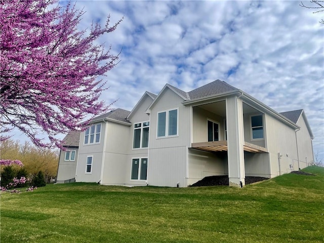 18300 Monrovia St, Overland Park, KS 66013 - back of house with a lawn