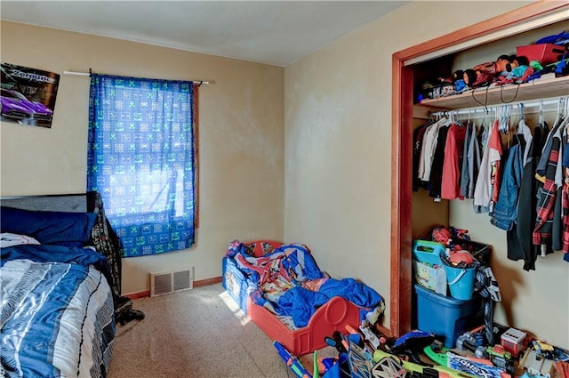 bedroom with carpet floors and a closet